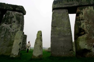  photograph showing Arch Druid Keeper of the Stones Terry Dobney inspecting the famous British landmark Stonehenge in Wiltshire, south west England.